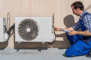 Man Doing Heating Ventilation And Air Conditioning Inspection