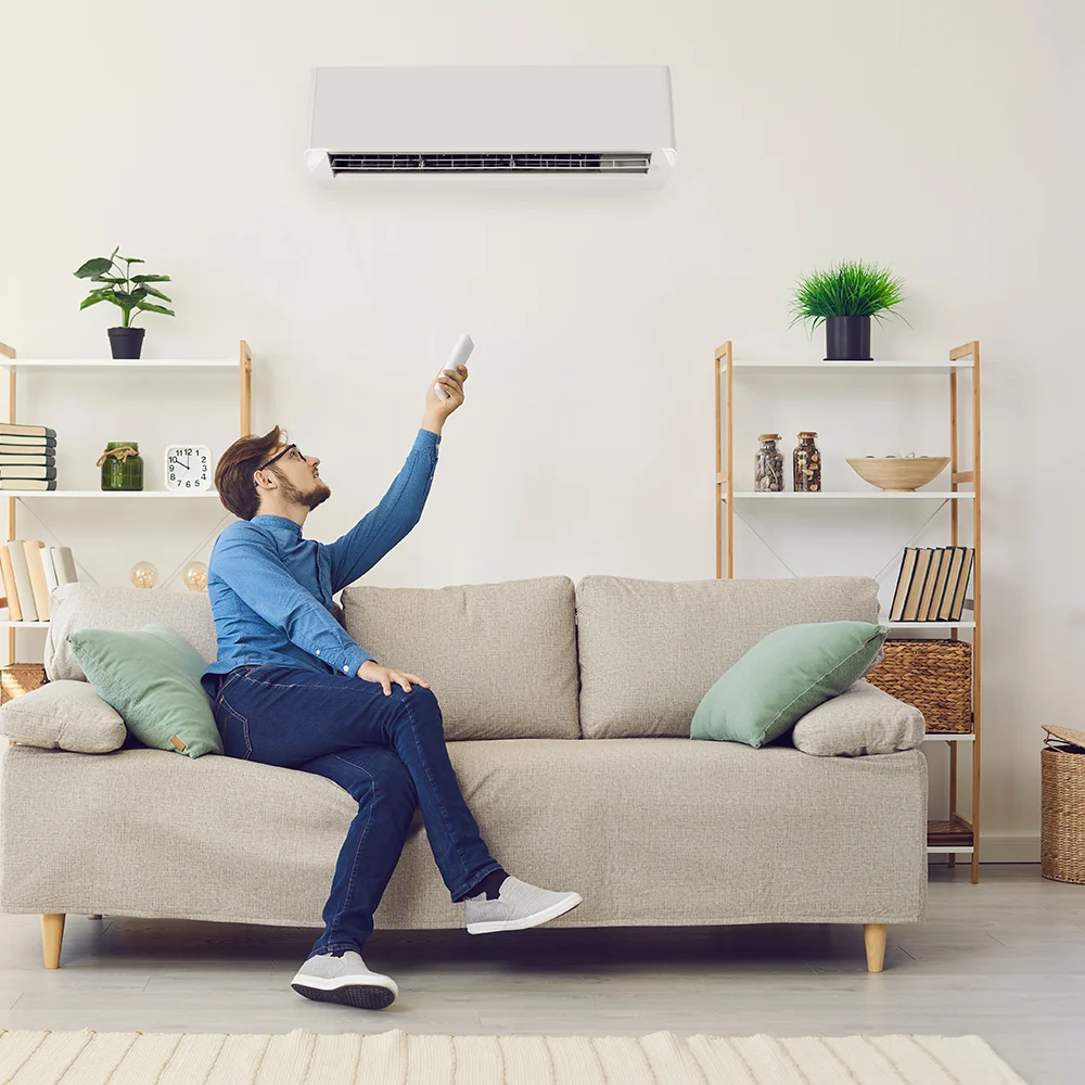 Man resting and enjoying good AC system at home. H